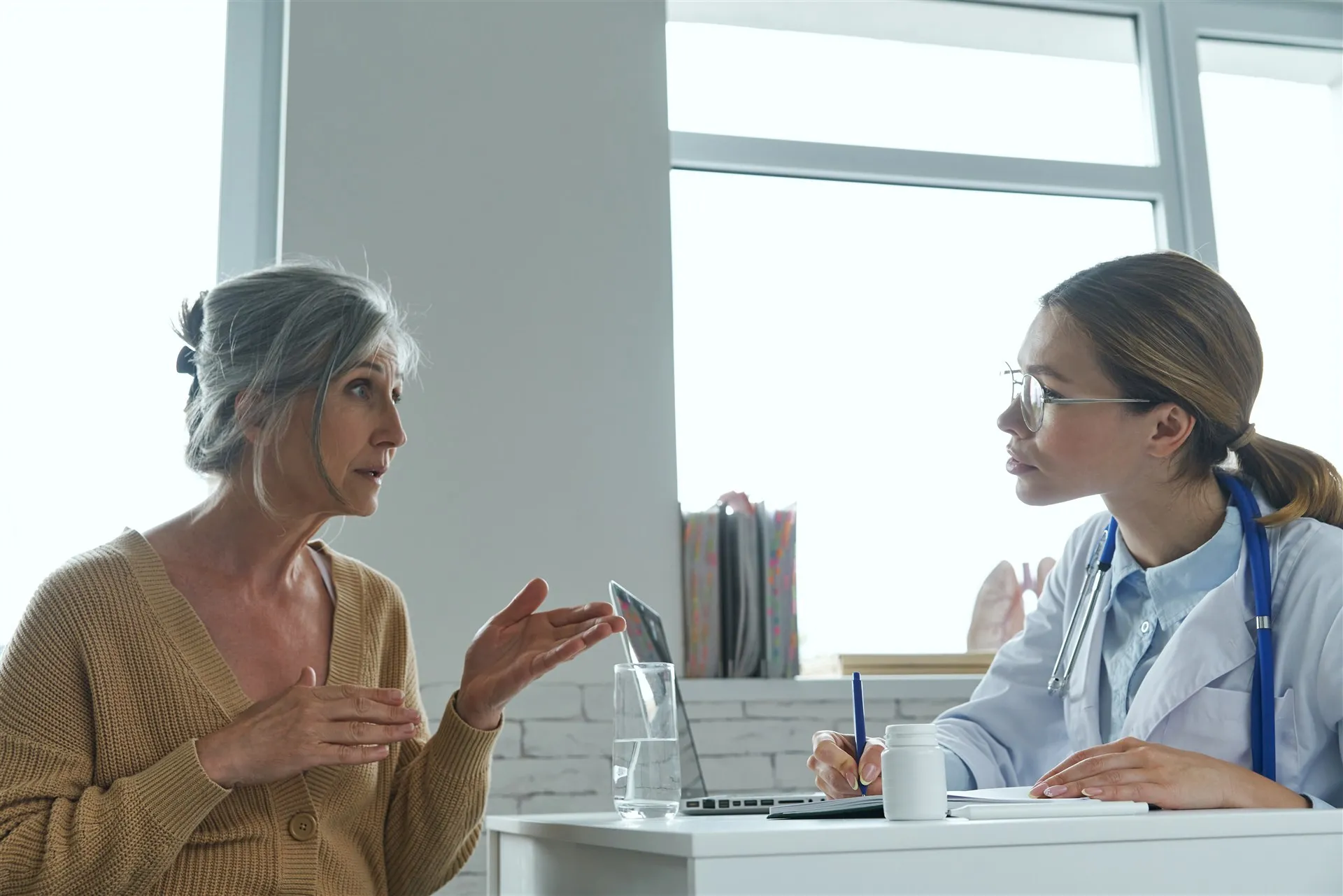 Woman talking with her healthcare provider about menopause treatment